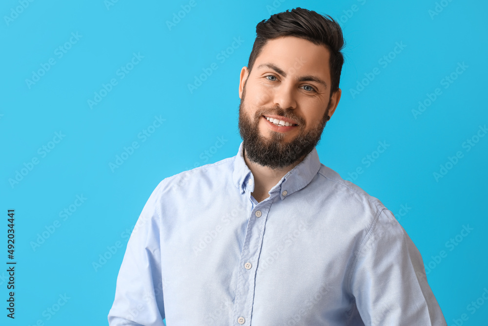 Stylish bearded man on blue background Stylish bearded man on blue background