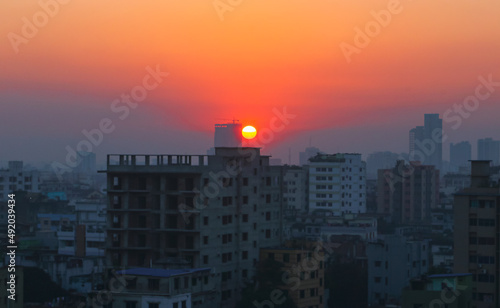 Sunset or sunrise at the city with building silhouette. Sunrise cityscape. Copy space.