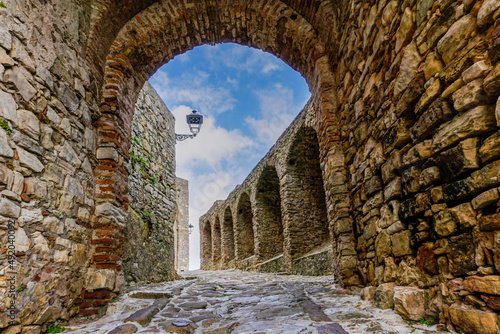 castle gate and walls in the historic city center of Castello de Castellar photo