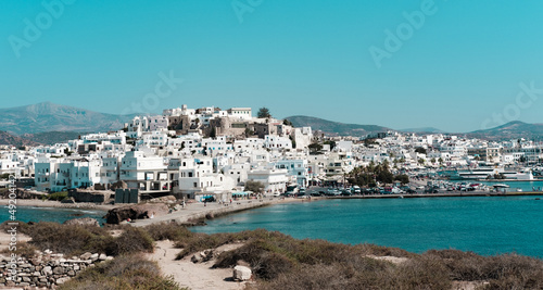 Fototapeta Naklejka Na Ścianę i Meble -  Chora town in Naxos Island view from portara inlet, white greek architecture, sea scape, town scape