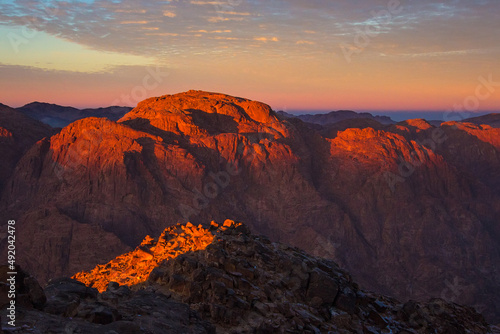 Sunrise on the summit of the Mount Sinai (Mount Horeb, Holy Mount Moses or Gabal Musa), Egypt, North Africa. Low exposure photo