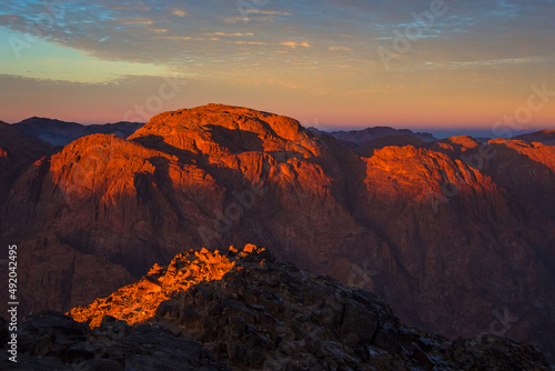 Sunrise on the summit of the Holy Mount Moses (Mount Sinai, Mount Horeb or Gabal Musa), Egypt, North Africa. Low exposure	 photo