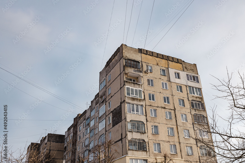 Wide shot of soviet-era building in western Ukraine in wintertime