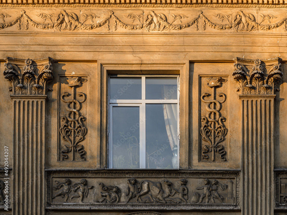 Elements of architectural decorations of buildings, sculptures and statues, public places in Lviv, Ukraine. Pilaster on the facade of an ancient building in the city center. 