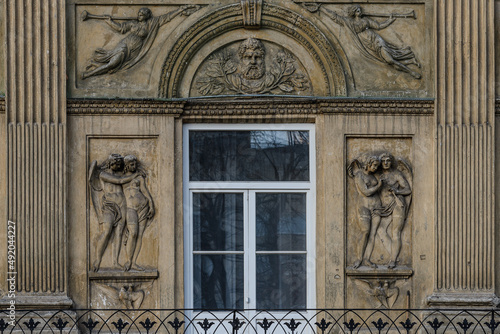 Elements of architectural decorations of buildings  sculptures and statues  public places in Lviv  Ukraine. Bas-relief of angels on the facade of an ancient building in the city center. 