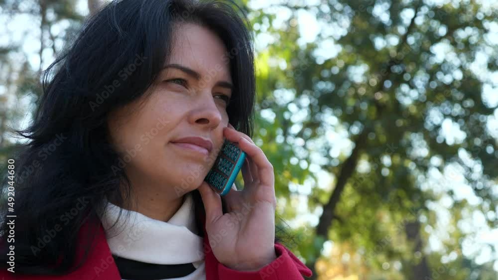 Beautiful Woman Talk Chatting on Phone. Businesswoman Use Smartphone For Conversation Rest in City Park. Serious Female Face. Autumn Day. 2x Slow motion 60 fps 4K Beautiful Woman Talk Chatting on Phone. Businesswoman Use Smartphone For Conversation Rest in City Park. Serious Female Face. Autumn Day. 2x Slow motion 60 fps 4K