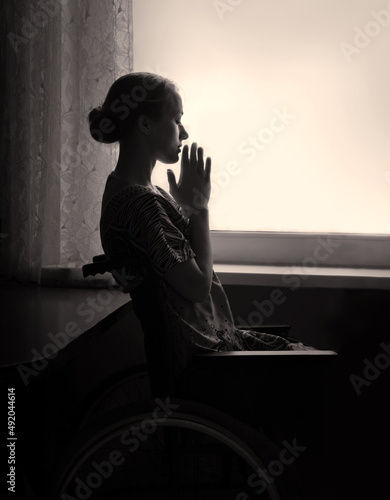 Fotografia Disabled person in stroller by window