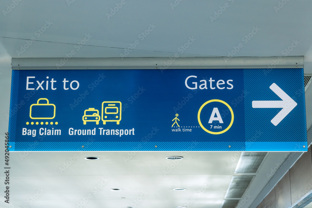 International Airport Sign Exit to Ground Transportation Baggage Claim Gates A in air terminal