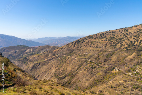 mountain landscape with winding mountain roads in the foothills of the Sierra Nevada in southern Spain