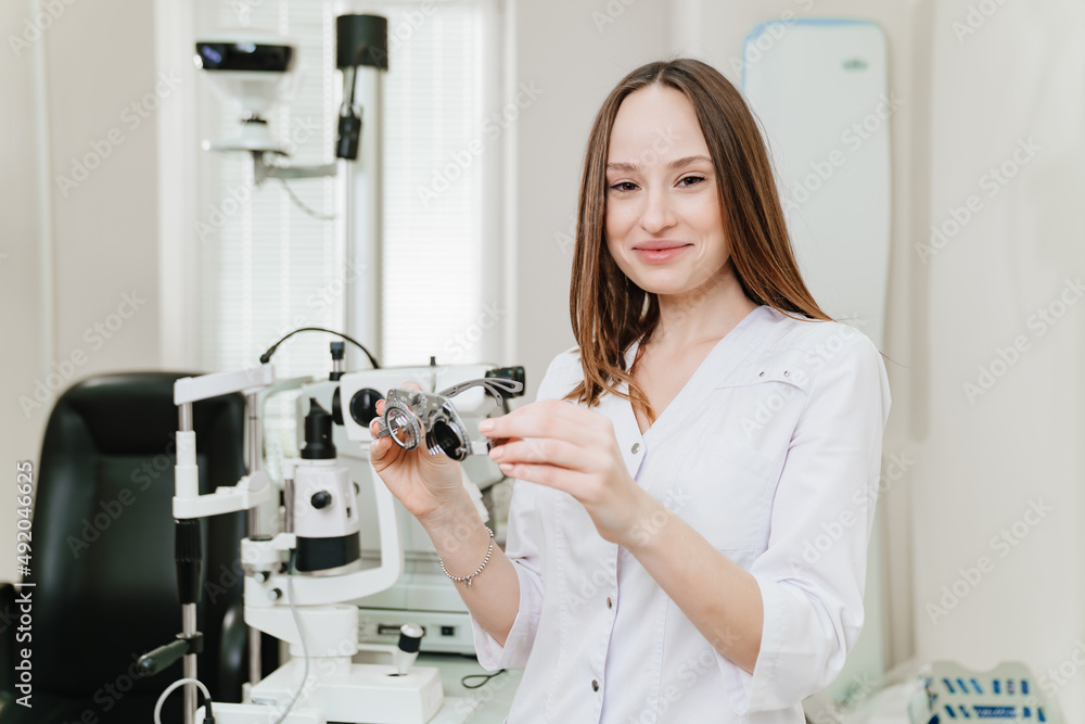 ophthalmologist with trial frame for selection of glasses, examination ophthalmologist with trial frame for selection of glasses, examination