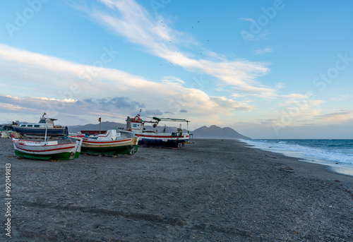 colorful fishing boats on the beach in Cabo de Gata at twilight
