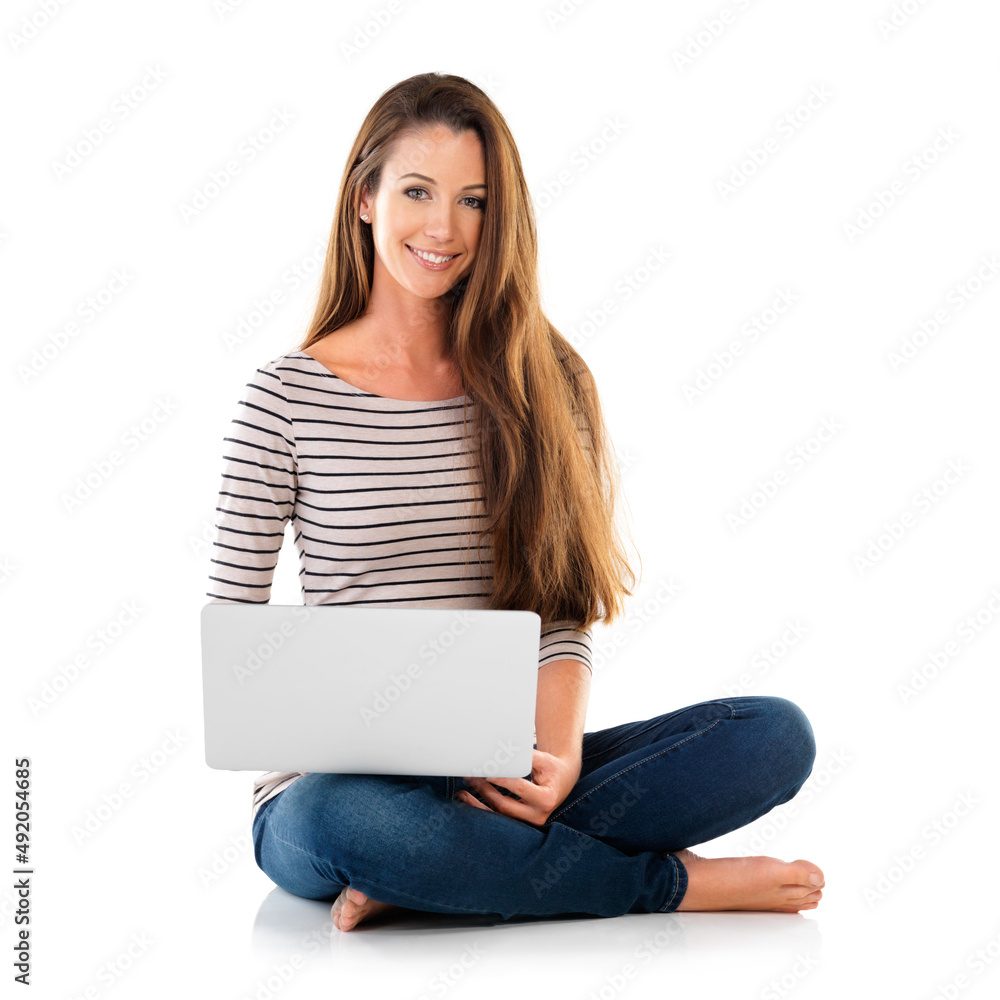 Browsing the web. Studio portrait of a young woman using a laptop against a white background. Browsing the web. Studio portrait of a young woman using a laptop against a white background.