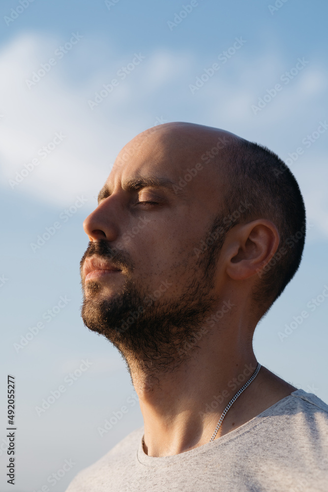 young man enjoying a warm summer day. close-up. young man enjoying a warm summer day. close-up.