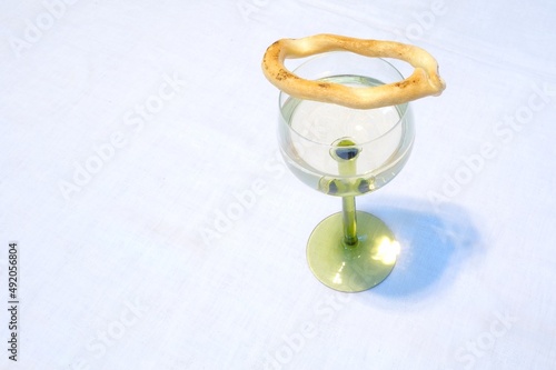 Savory biscuits on a glass of white wine
