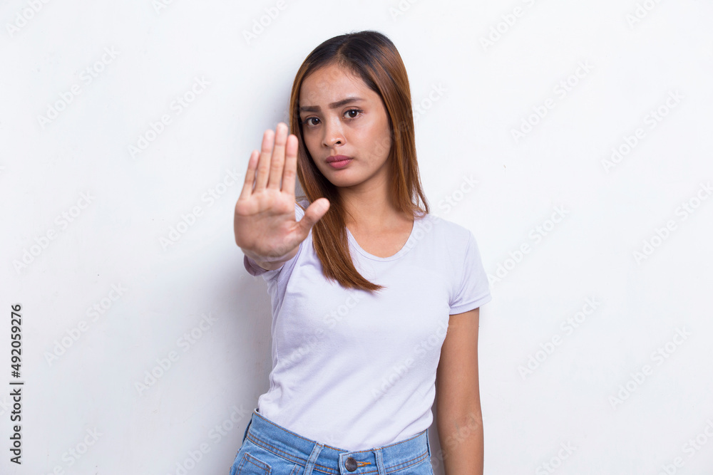 beautiful young woman with open hand doing stop sign with serious expression defense gesture isolated on white background
beautiful young woman with open hand doing stop sign with serious expression defense gesture isolated on white background