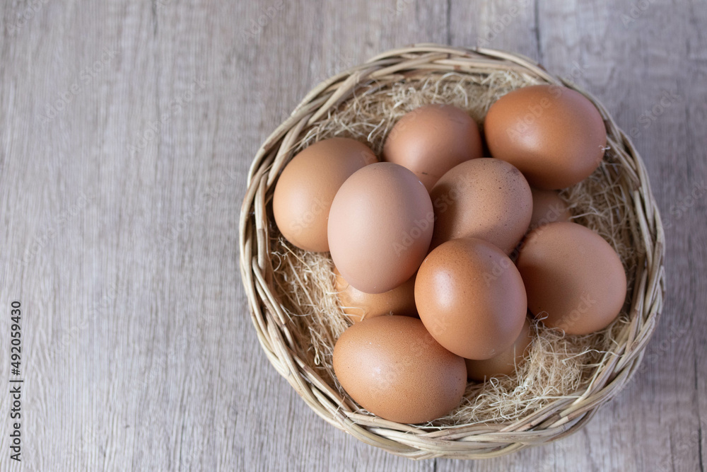 fresh chicken eggs in a wicker basket fresh chicken eggs in a wicker basket
