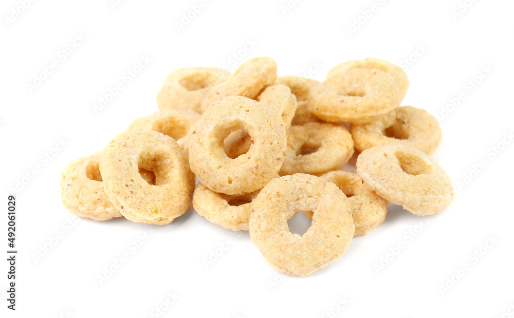 Pile of tasty corn rings on white background, closeup. Healthy breakfast cereal