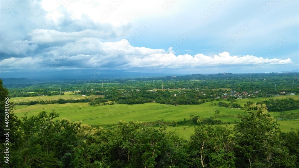 landscape with green grass and clouds landscape with green grass and clouds