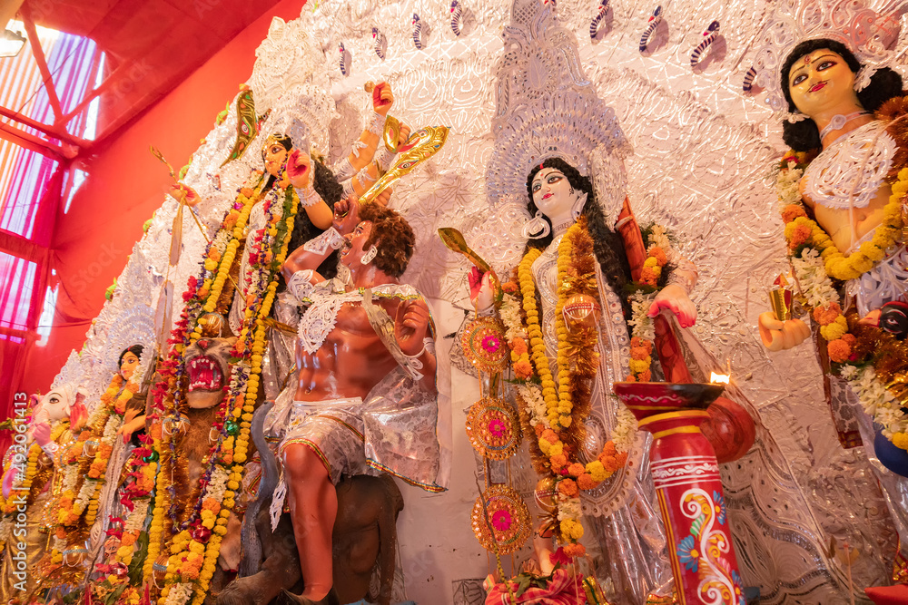 Goddess Durga idol at decorated Durga Puja pandal, at Kolkata, West Bengal, India. Durga Puja is biggest religious festival of Hinduism and is now celebrated worldwide.