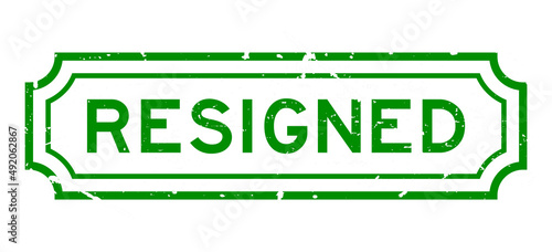 Grunge green resigned word rubber seal stamp on white background