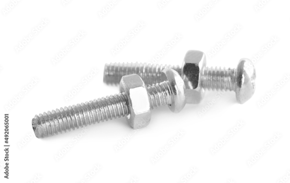 Metal carriage bolts with hex nuts on white background Metal carriage bolts with hex nuts on white background