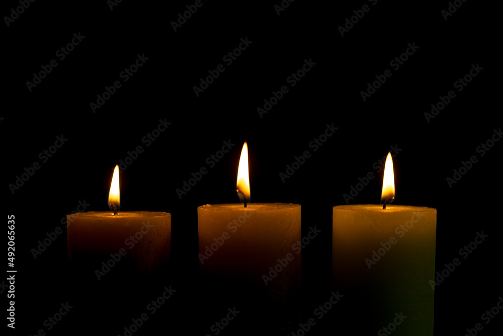 Warm candlelight on a dark mysterious background Warm candlelight on a dark mysterious background