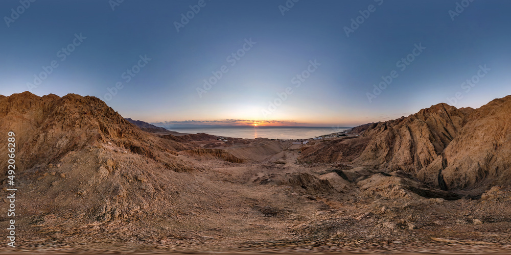 full seamless spherical hdri 360 panorama view of dawn on coast of sea high in sandy mountains with morning sun in equirectangular projection, ready for VR AR virtual reality