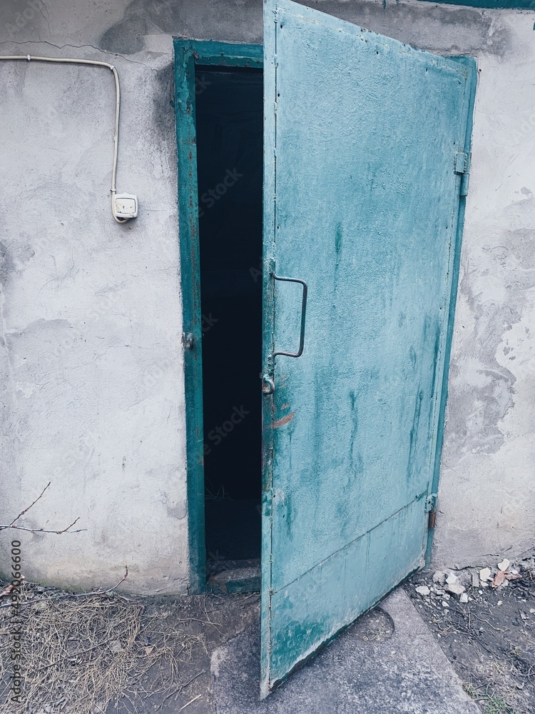 War time. Cellar. The war in Ukraine. The door to the cellar is shockproof. Tank armor door War time. Cellar. The war in Ukraine. The door to the cellar is shockproof. Tank armor door