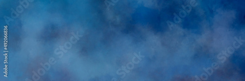 Painted dark blue gray cloudy overcast sky or color smoke background abstract watercolor texture in inky blue header design