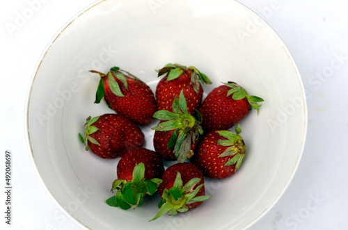 Strawberry in white bowl photo