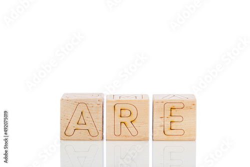 Wooden cubes with letters are on a white background