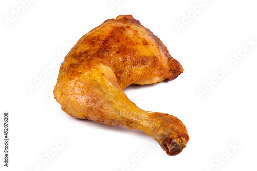 Fresh roasted chicken leg quarters on white isolated background.