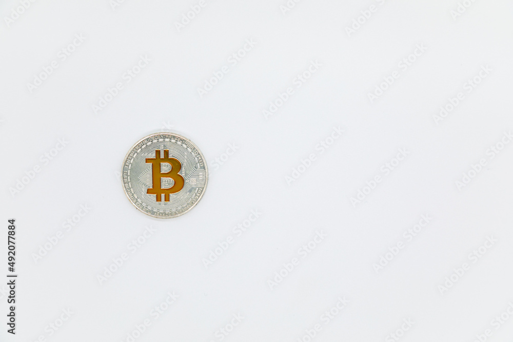 Top view of Bitcoin silver coin on a white background