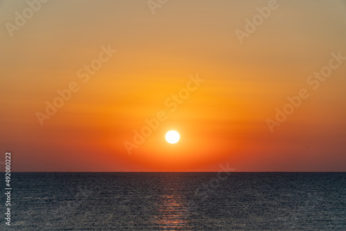 The sun rising over the horizon © nikolay100