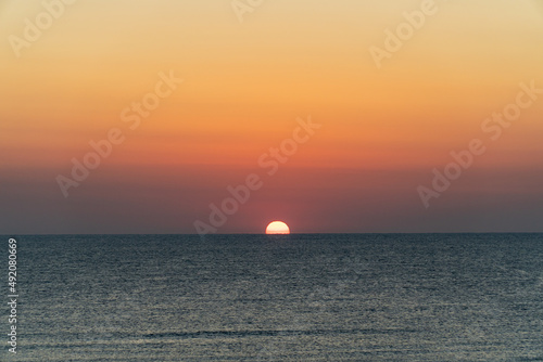 Fototapeta Naklejka Na Ścianę i Meble -  The sun rising over the horizon
