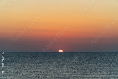The sun rising over the horizon © nikolay100