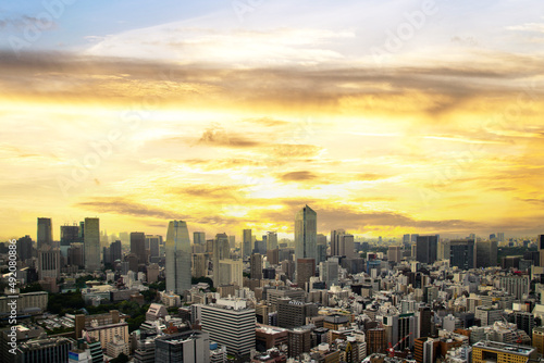 Tokyo Skyline, japan cityscape at twilight, view of office building and downtown and street of minato in tokyo with sunset / sun rise sky background. Japan, Asia