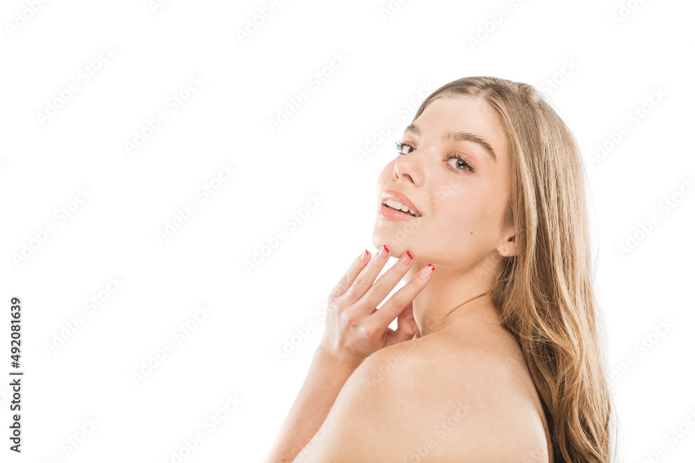 Beautiful girl touching her face and posing while smiling