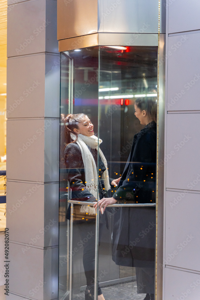 Talking in the elevator while going up Talking in the elevator while going up
