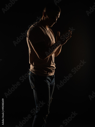 Perfect silhouette of a guy posing in studio