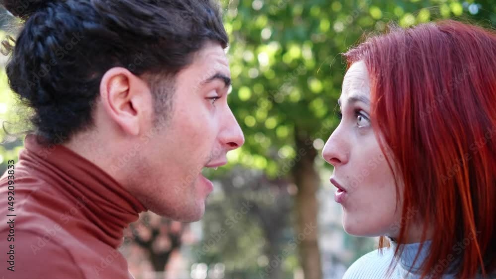 violent quarrel - young couple argues screaming and accusing each other violent quarrel - young couple argues screaming and accusing each other