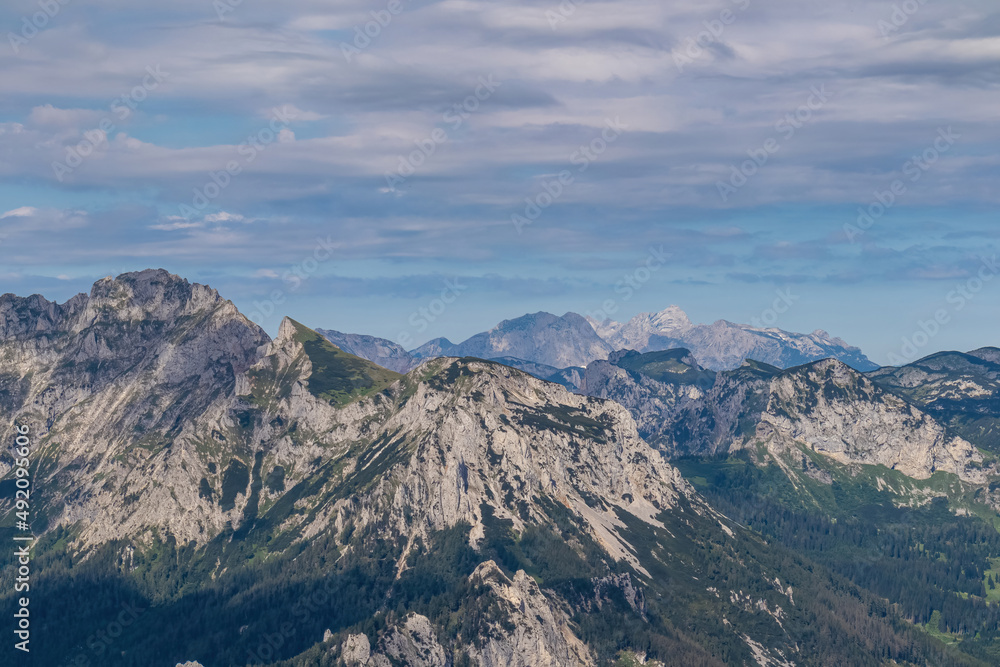 Panoramic view from Messnerin on the alpine mountain chains in Styria, Austria, Hochschwab region. Hills overgrown with small bushes, higher parts rocky and bare. Summer day. Hiking in Alps, Tragoess Panoramic view from Messnerin on the alpine mountain chains in Styria, Austria, Hochschwab region. Hills overgrown with small bushes, higher parts rocky and bare. Summer day. Hiking in Alps, Tragoess