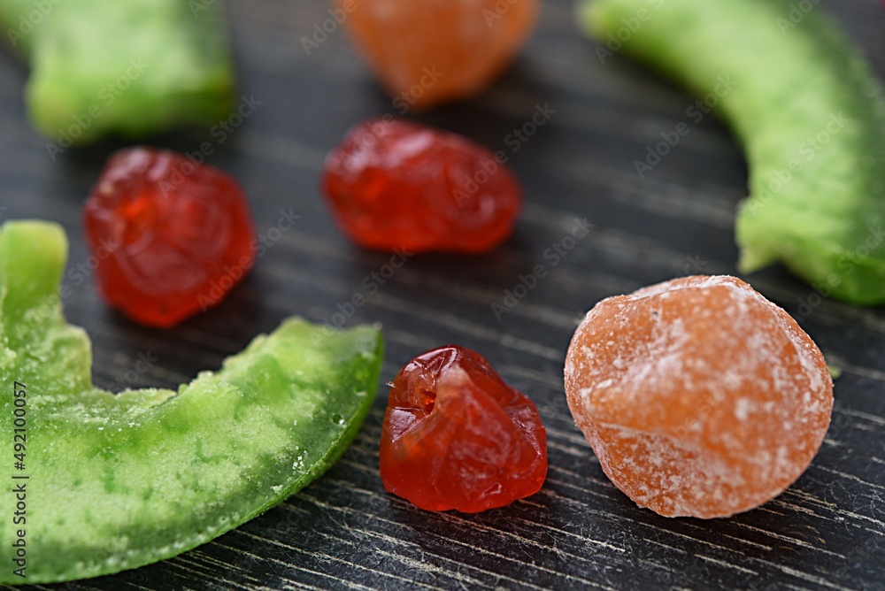 multi-colored dried fruits cherry pomelo on a dark background multi-colored dried fruits cherry pomelo on a dark background