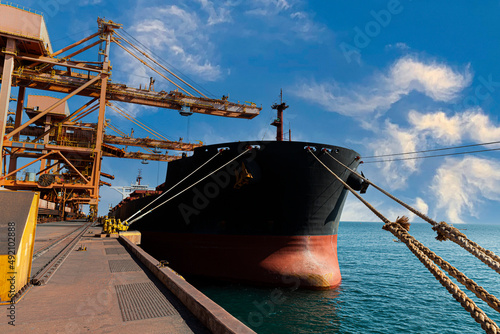 A picture of the industrial sea port of Sohar in the northern part of the Sultanate of Oman, cargo ships in the port of Sohar, the beauty of the landscape in the Sultanate of Oman, ports and harbors o