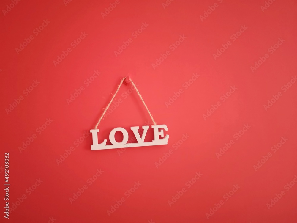 love written in wood hanging on the wall love written in wood hanging on the wall