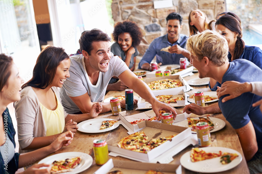 Getting together for pizza. Cropped shot of a group of friends enjoying pizza together.