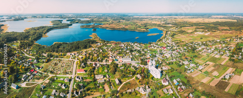 Slobodka, Braslaw District, Vitebsk Voblast, Belarus. Aerial View Of Potsekh Lake Near Slobodka Village. Church of Divine Providence. Panorama.