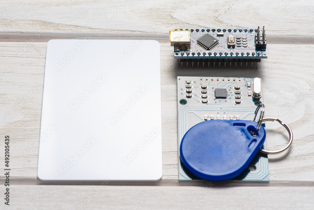 key, card and module on the white background close up. Stock