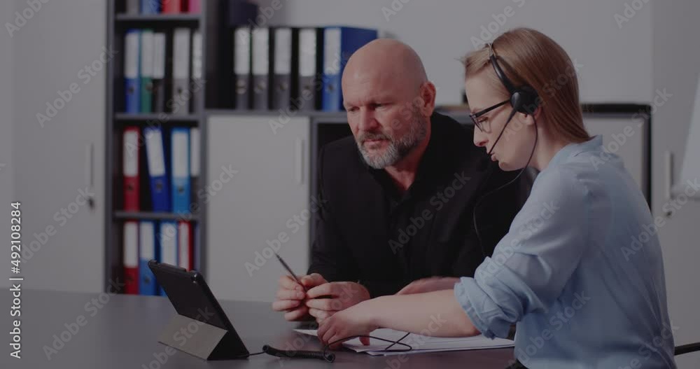 Coworkers discussing in online meeting at office Coworkers discussing in online meeting at office