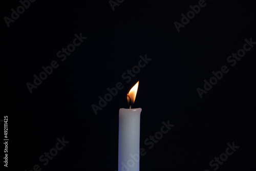 candle in the dark. candle on a black background. Fire candles on a black background